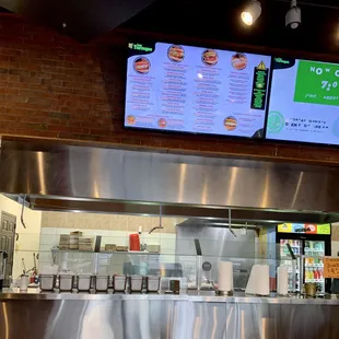 a restaurant counter and menus