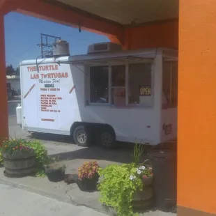a food truck parked in front of a building