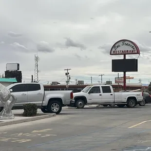 a white truck parked in a parking lot
