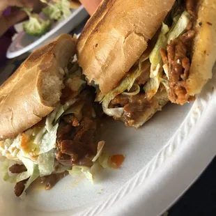 Torta de Pastor with all toppings, and if asked, with refried beans!