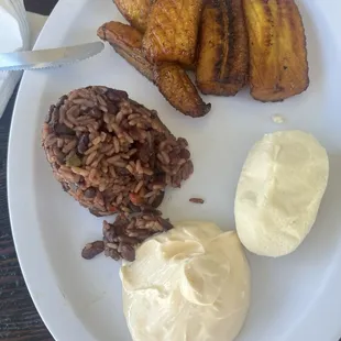 Small típico plate, the plantain very sweet, crema cheese and rice with beans like casamiento