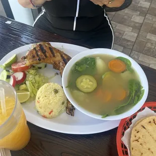 Chicken soup with vegetables rice, and salad, also a passion fruit drink here..DELICIOUS!