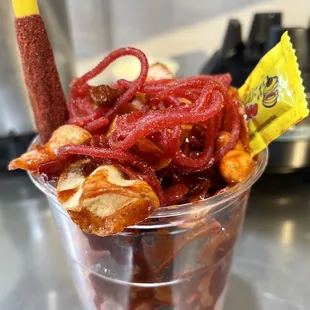 a plastic cup filled with snacks