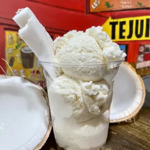 a glass of ice cream with a spoon in it