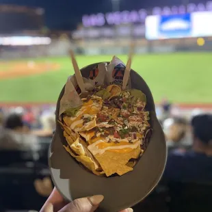 Carne Asada nachos in a souvenir cap