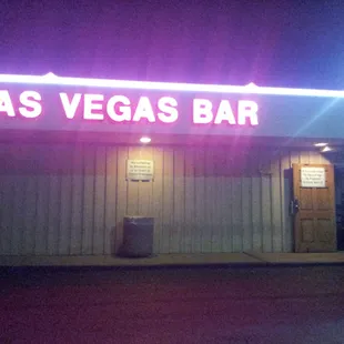 the neon sign for the bar