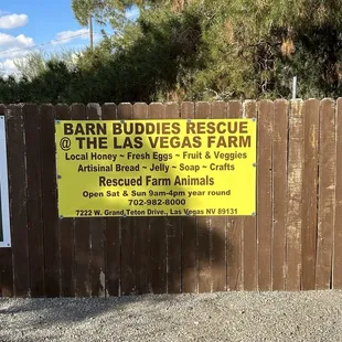 a sign for the barn buddies rescue