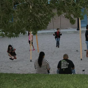 children playing on swings