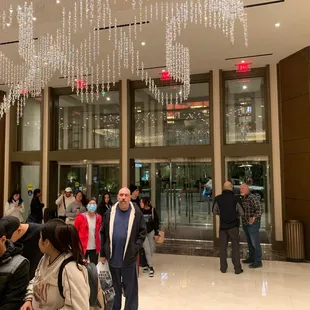 People in a long line over the door