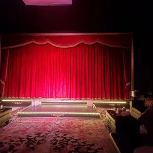 The show is about to begin. Notice the VIP couches in yhe front.