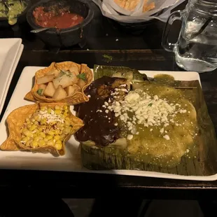 Lime potatoes, esquites, chicken tamale with mole, pork tamale with chile verde. Tamales were dry despite sauce on top.