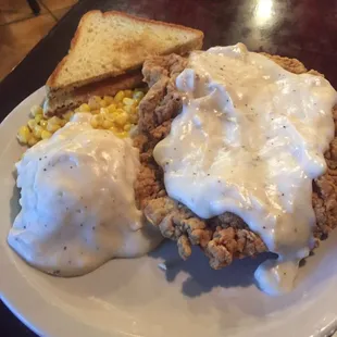 Chicken Fried Steak with gravy, mashed potatoes, corn, and toast