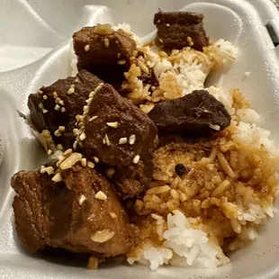 rice and meat in a styrofoam container