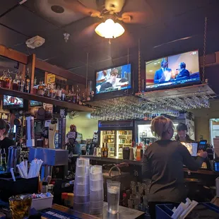 two people sitting at the bar