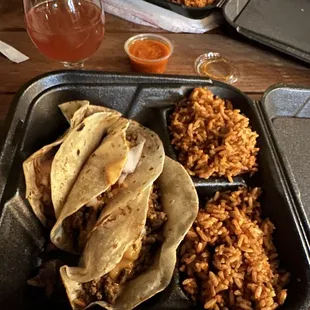 Carne asada tacos and jollaf rice