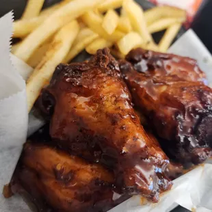 Sauced wings and fries.