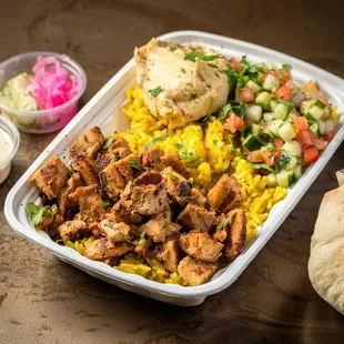 a tray of chicken and rice
