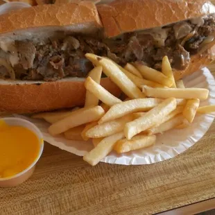 10 inch mushroom supreme cheesesteak with fries and cheez whiz.