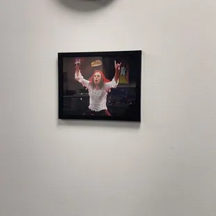 a picture of a man in a santa suit and a clock on the