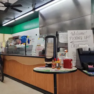 a restaurant counter with a bicycle parked in front of it