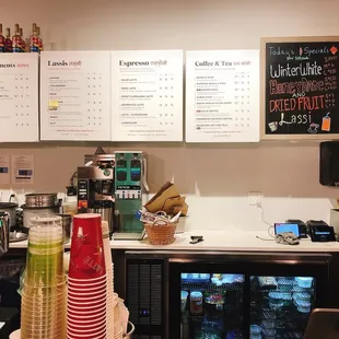 a coffee shop with menus on the wall