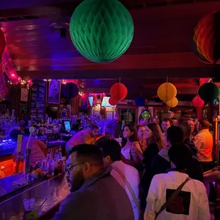 a crowd of people at the bar