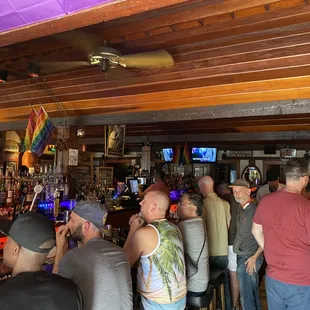 a large group of people at the bar