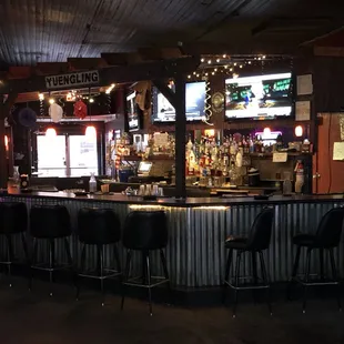 Beautiful bar with three large TVs to watch all of your favorite sports