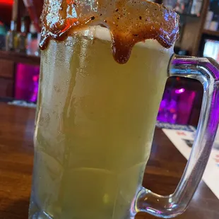 a glass of beer on a table