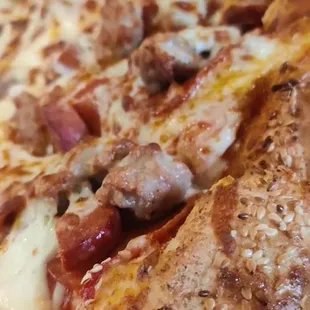 a pizza with meat and cheese