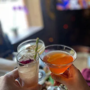 two cocktails in front of a tv