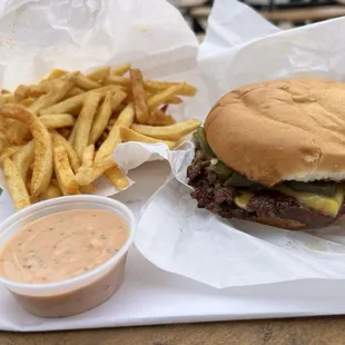 Jalapeño cheeseburger w/ seasoned fries and everything sauce