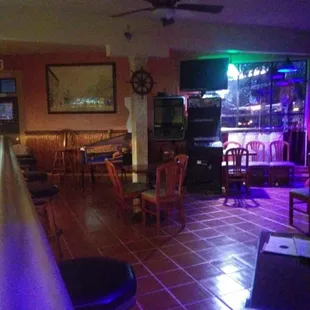 a bar with purple lighting