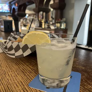 a glass of lemonade with a slice of lemon