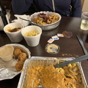 a woman sitting at a table with food