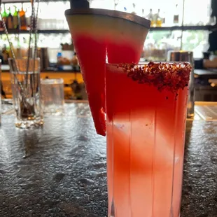 a watermelon drink with a slice of watermelon