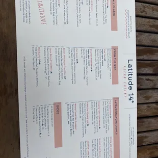 a menu on a wooden table