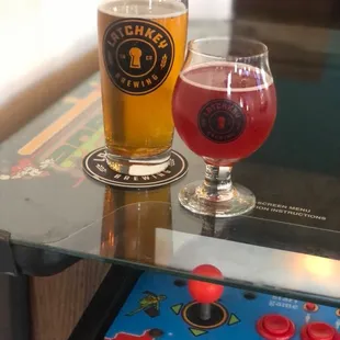a pinball and a glass of beer