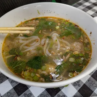 Khao pork....lao chicken noodle soup. Noodles are soft and chewy like mochi. Broth is