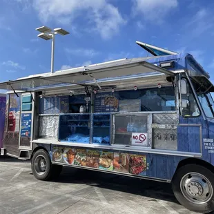 a food truck parked in a parking lot