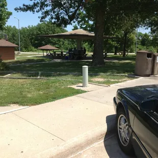 Lots of grass and shady areas with picnic tables