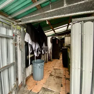 Clean Aprons hanging up to dry behind restaurant