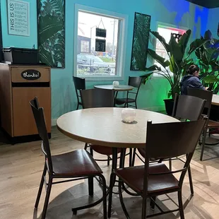 a table and chairs in a restaurant