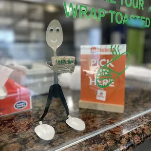 a plastic spoon and spoon holder