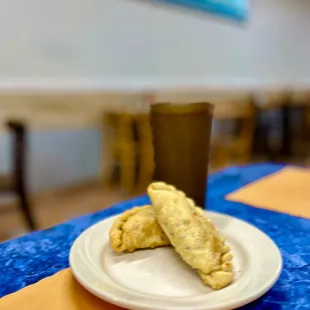 a plate of pastries and a cup of coffee