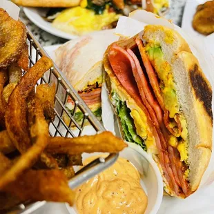 a plate of food and a basket of fries