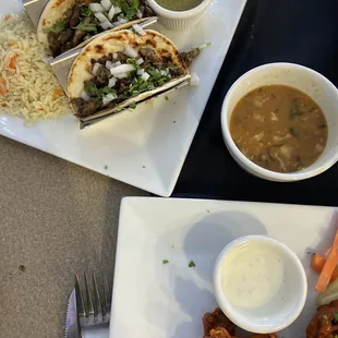 Beef fajita tacos with charro beans and wings