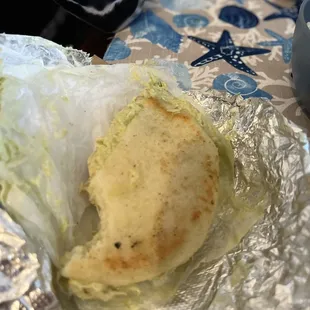 Reina Pepiada   Filled with Chicken, Cabbage and mashed Avocado.