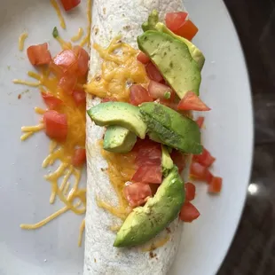  burrito with tomatoes, avocado and cheese