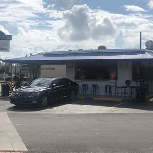 a car parked in front of a restaurant